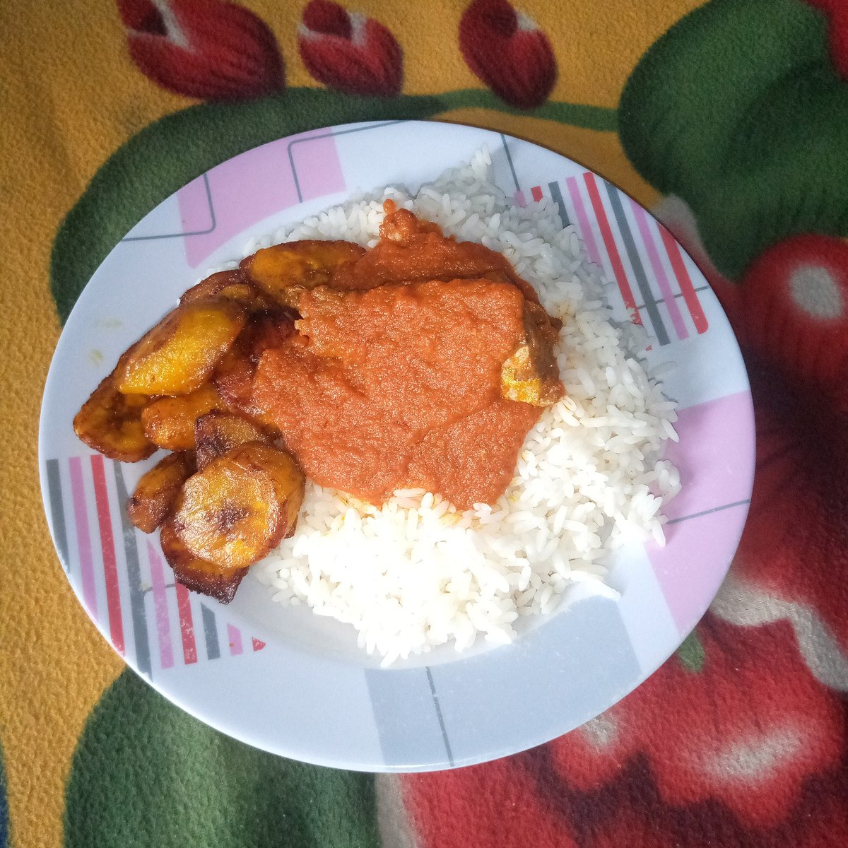 Rice and beans with stew and fried plantain