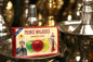 Box of Prince Molasses apple flavour shisha tobacco displayed among hookahs