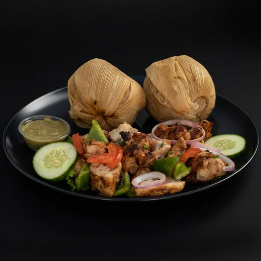 Kenkey and fried fish plate, close view
