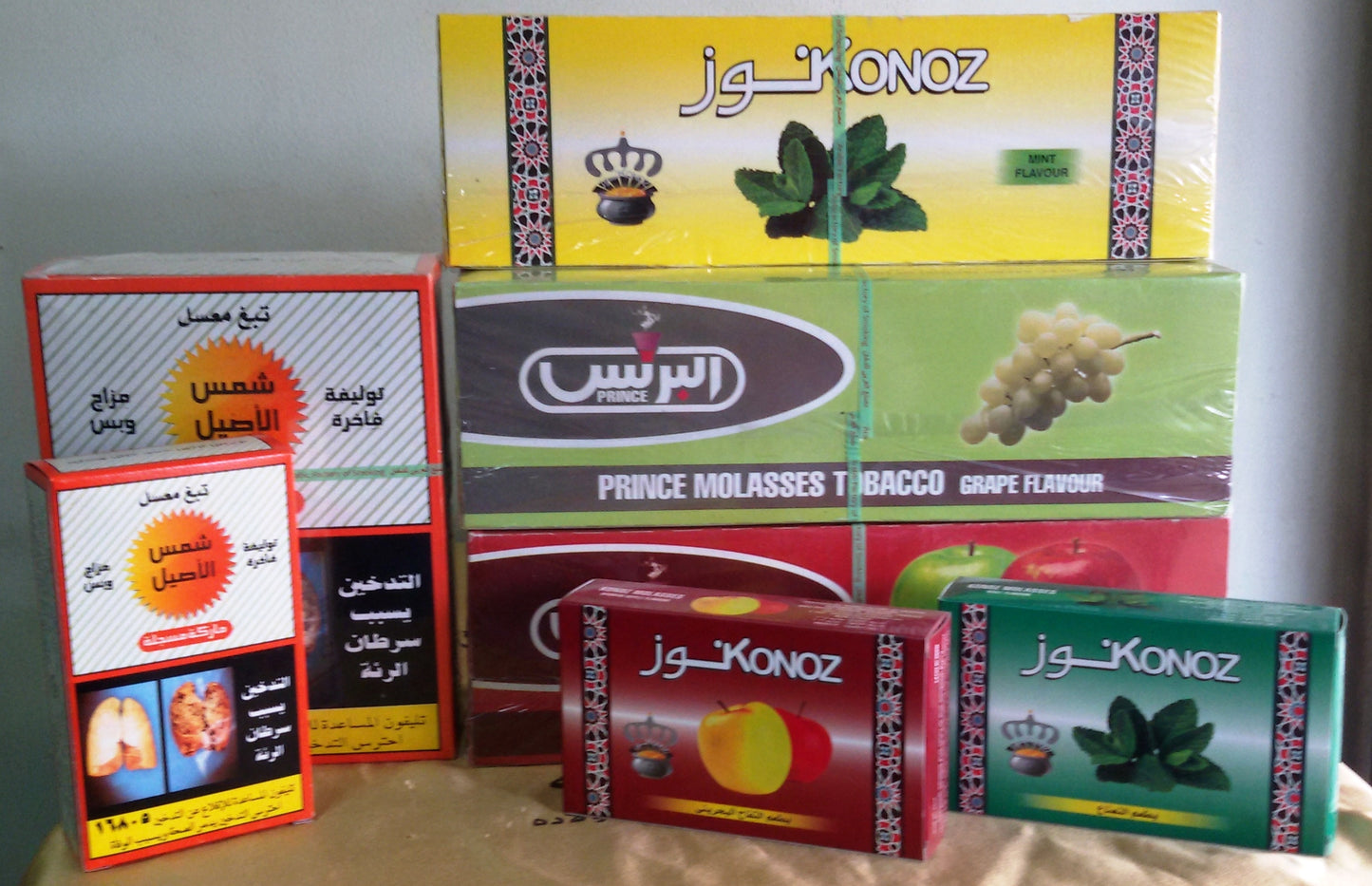 Assorted packs of mint, grape and apple shisha molasses tobacco