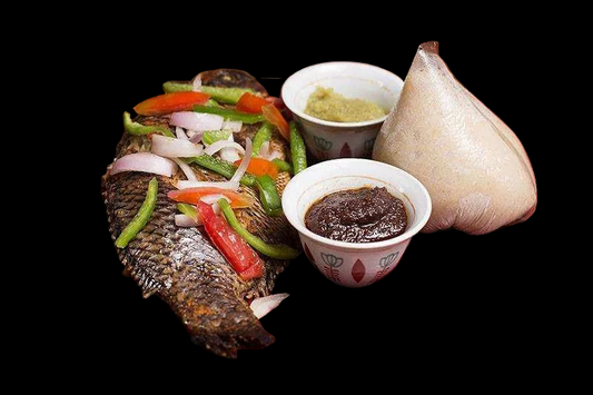 Banku with grilled tilapia and pepper sauce