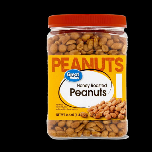 Jar of peanuts on black background