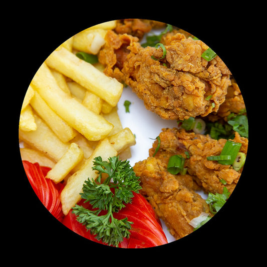 Fried chicken and fries on black background