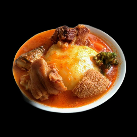 Fufu in light soup on black background
