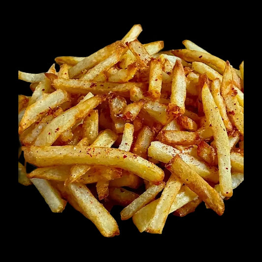 French fries on black background