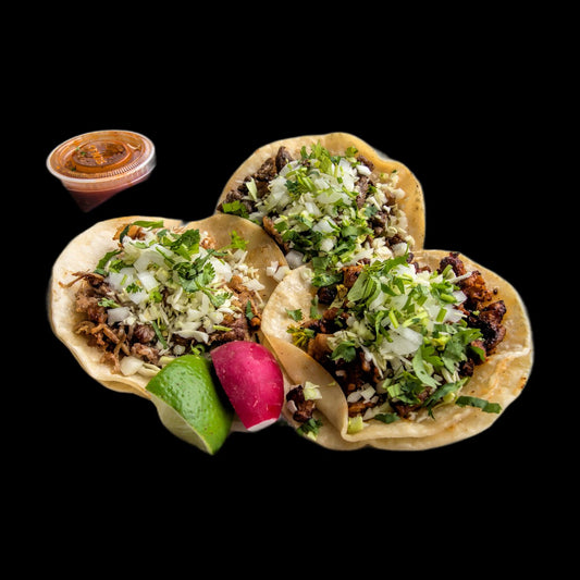 Three street tacos on black background