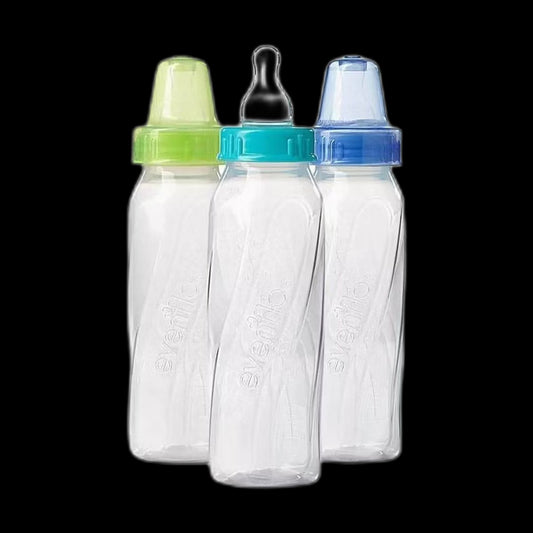 Baby feeding bottles on black background
