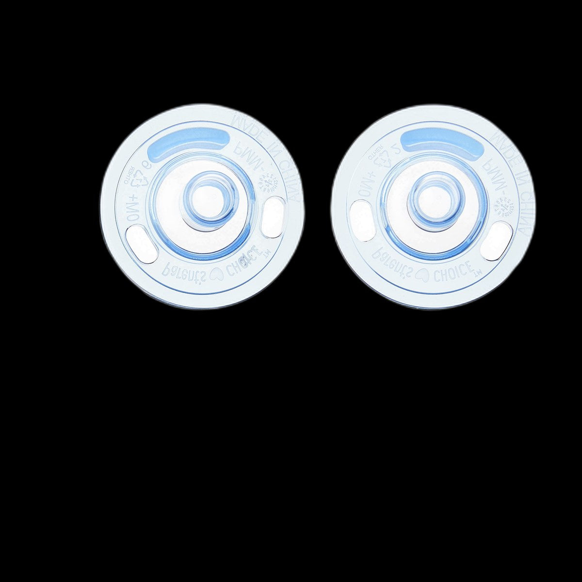 Silicone pacifiers on black background