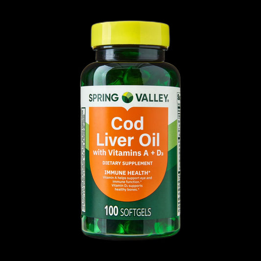 Cod liver oil capsules on black background