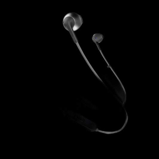Wireless earbuds on black background