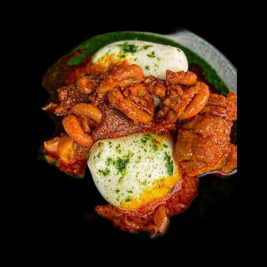 Tuo zaafi with ayoyo soup on black background