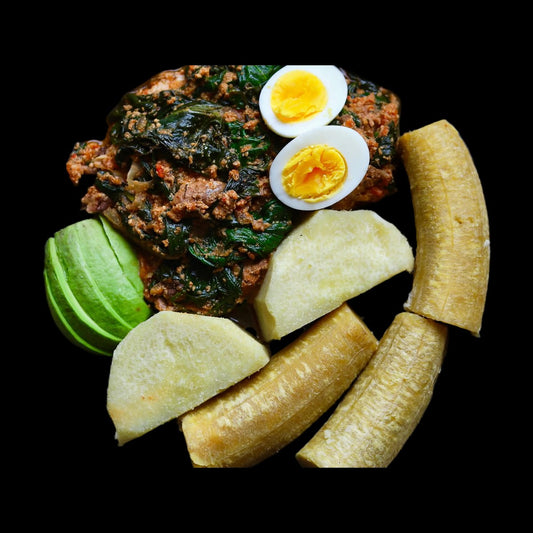Yam and kontomire stew on black background