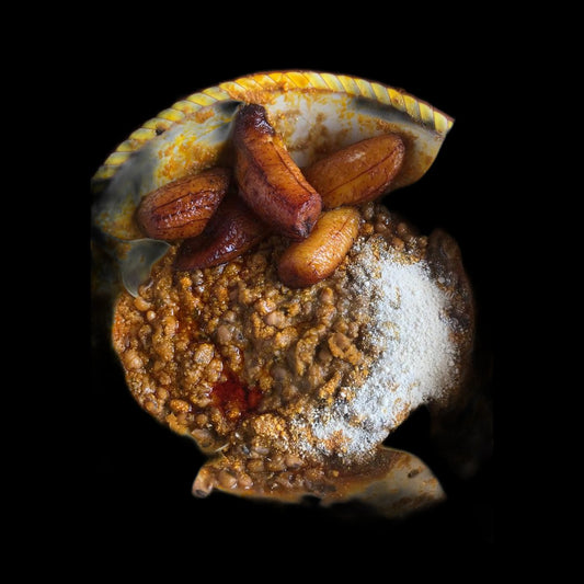 Beans and gari with plantain on black background