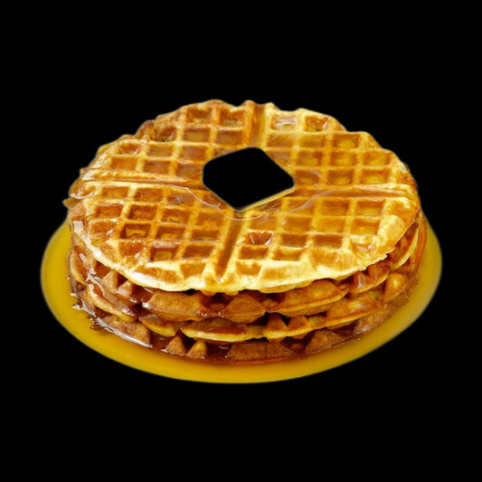 Waffles with maple syrup on black background