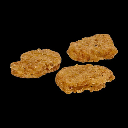 Crispy chicken pieces on black background