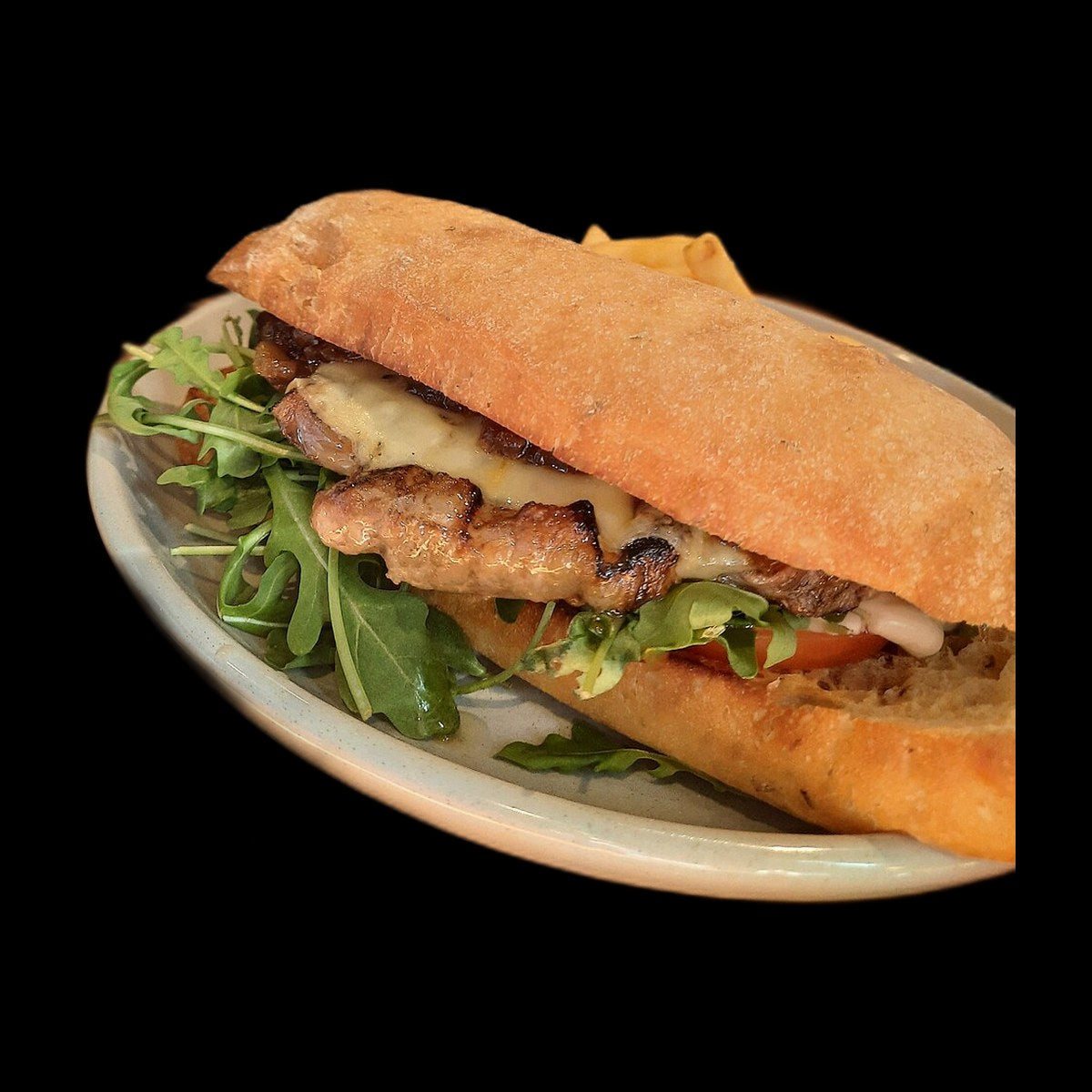 Suya steak sandwich on black background