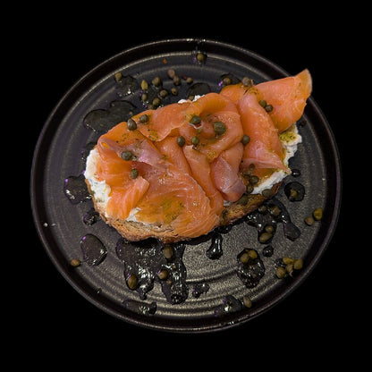 Smoked salmon toast on black background