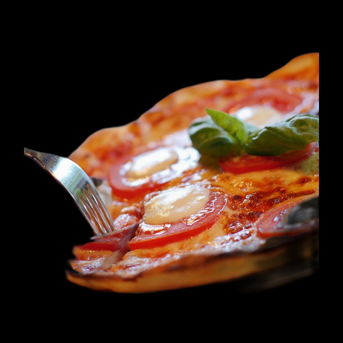 Margherita pizza on black background