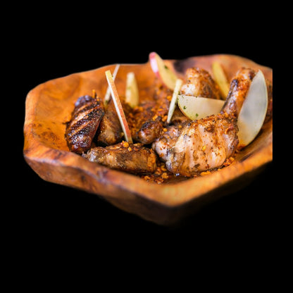 Honey butter wings on black background