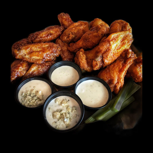 Buffalo wings on black background