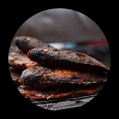 Grilled tilapia platter on black background
