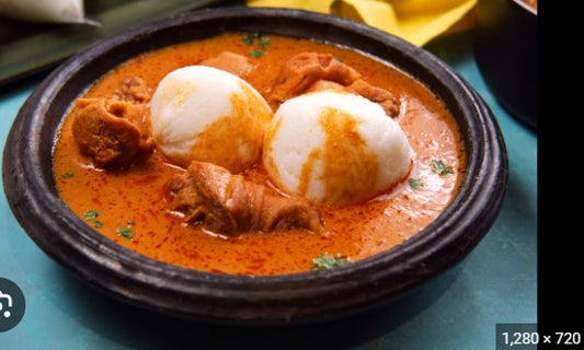 Rice balls (omo tuo) in groundnut soup